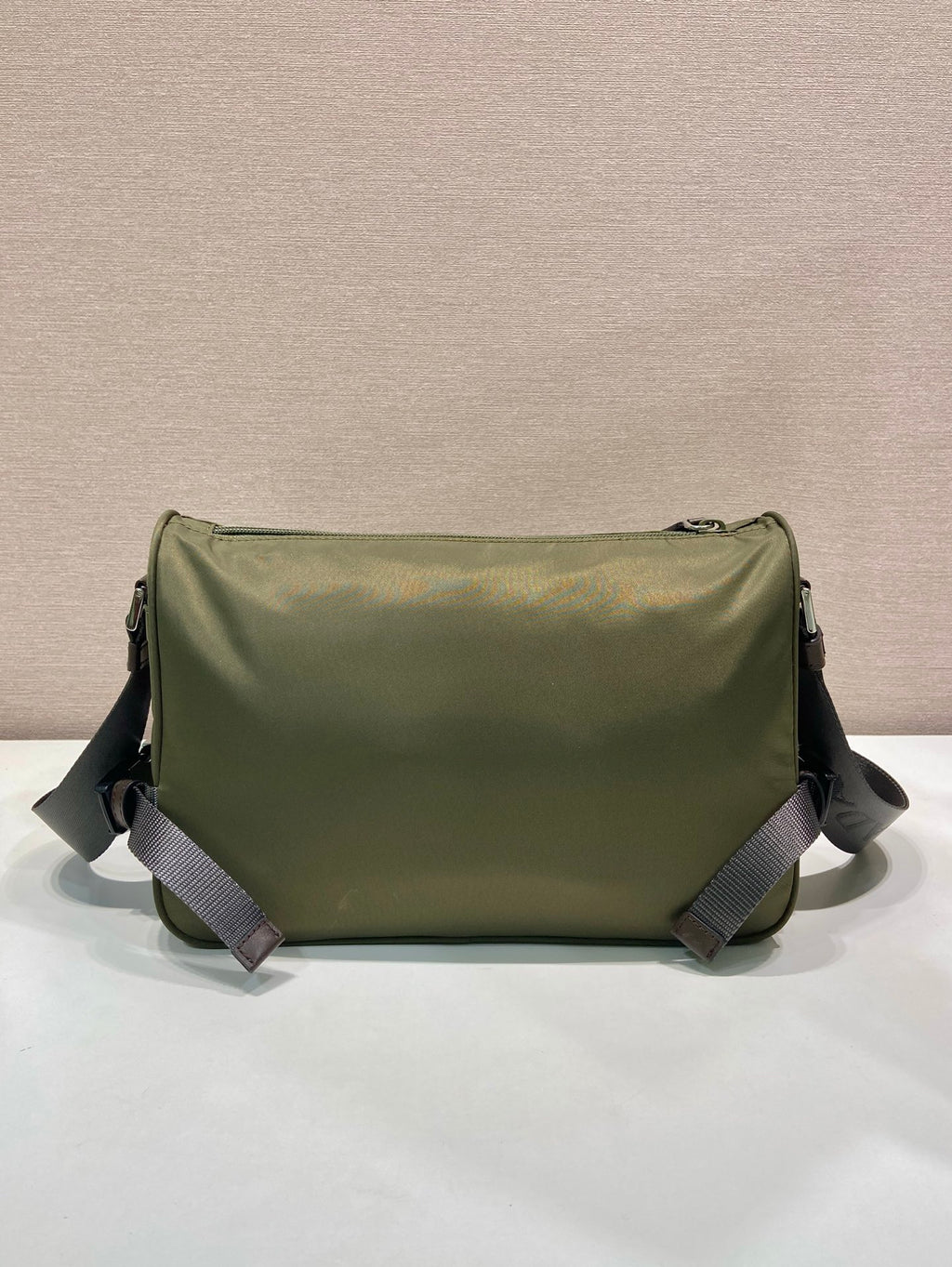 Olive Prada shoulder bag with rounded flap and adjustable shoulder straps