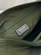 Olive Prada label patch on zippered bag pocket with made in Italy text