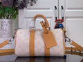 Louis Vuitton duffel bag with tan leather handles and monogram canvas, crossbody strap