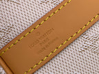 Louis Vuitton leather label on tan edge, stitched over beige fabric