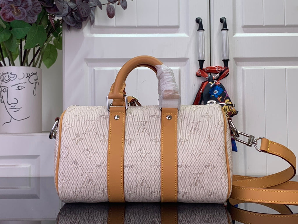 Men's Louis Vuitton duffel bag with tan handles, beige canvas exterior and side straps
