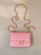 Pink quilted Chanel flap crossbody bag with gold-tone logo and chain strap