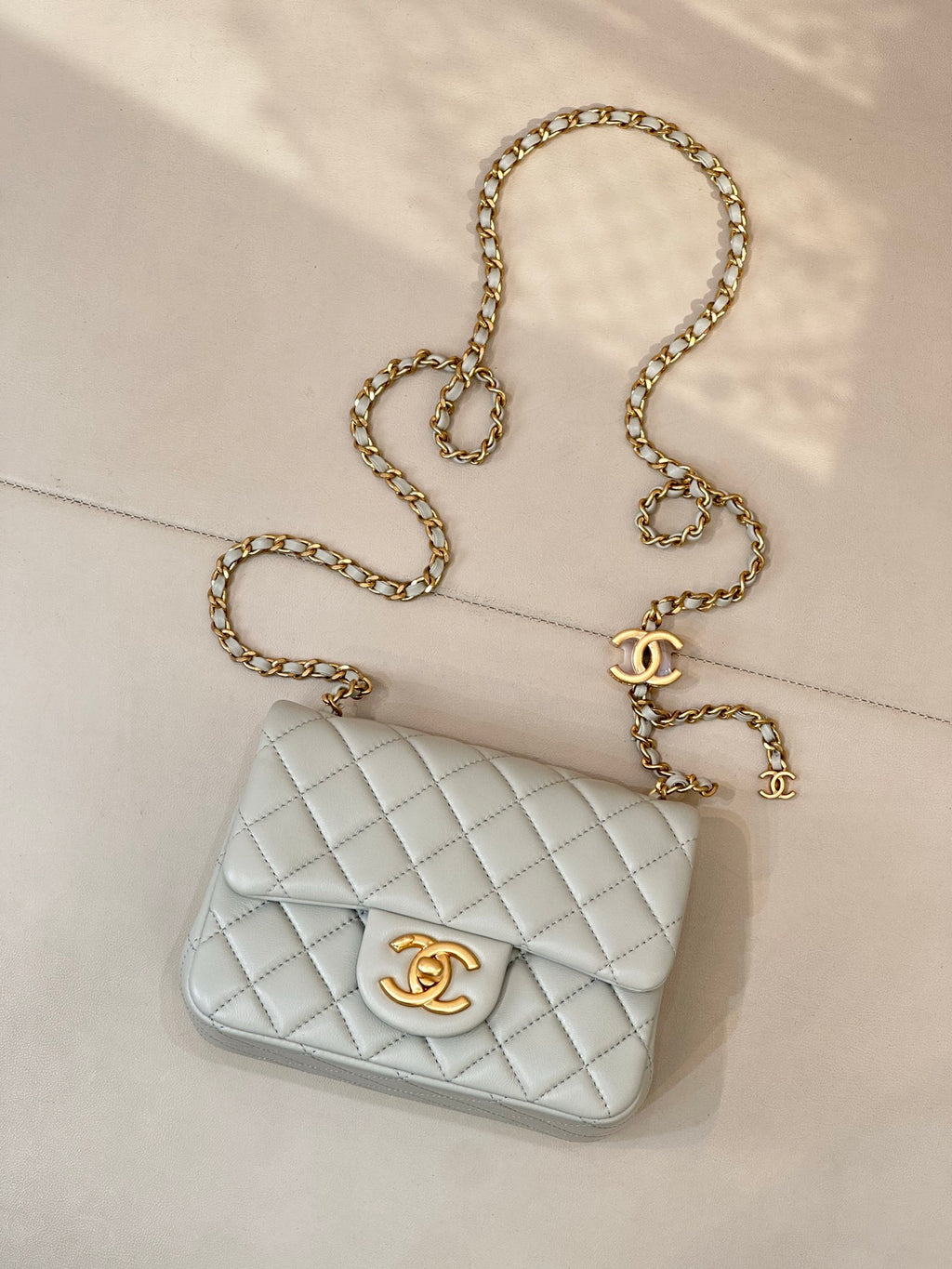 Chanel quilted shoulder bag, light blue front flap with gold chain