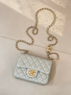 Chanel quilted shoulder bag, light blue front flap with gold chain