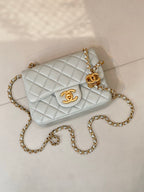 Chanel quilted crossbody bag, light blue with gold chain and front CC logo
