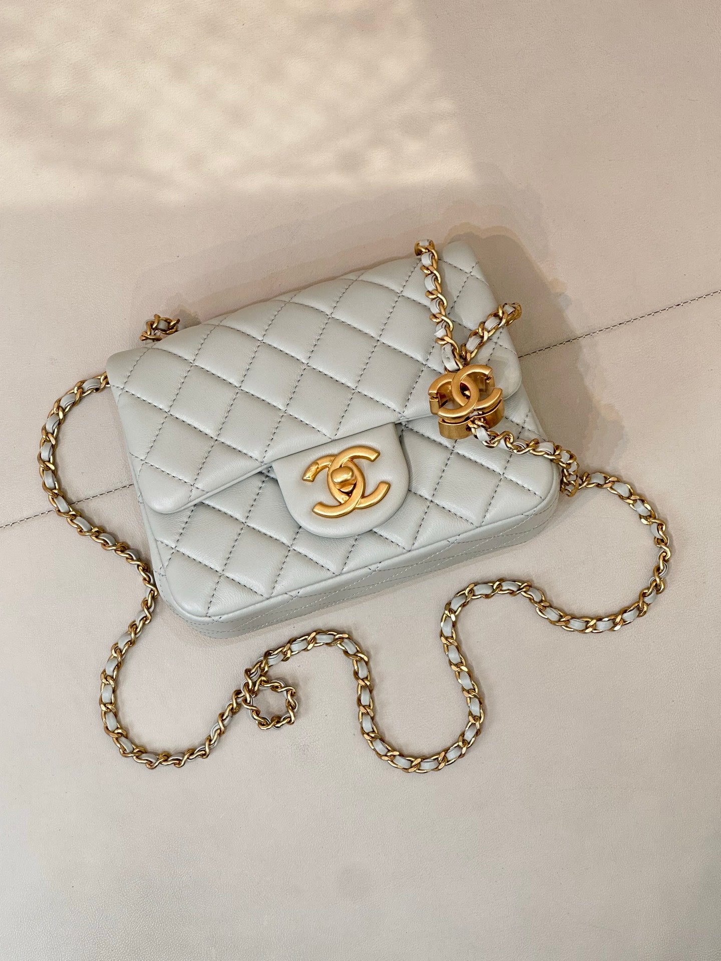 Chanel quilted crossbody bag, light blue with gold chain and front CC logo