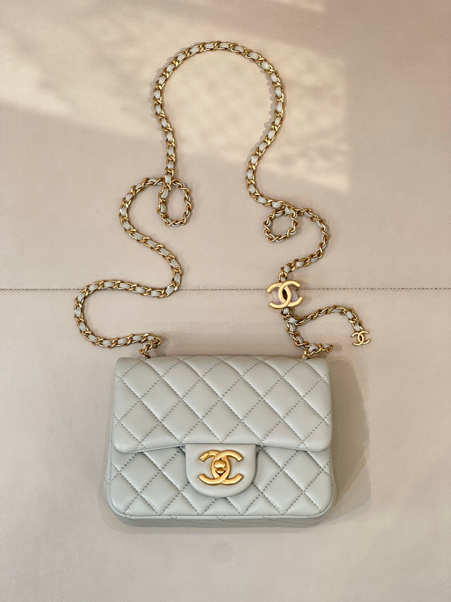 Chanel quilted shoulder bag, light blue with gold chain and CC logo