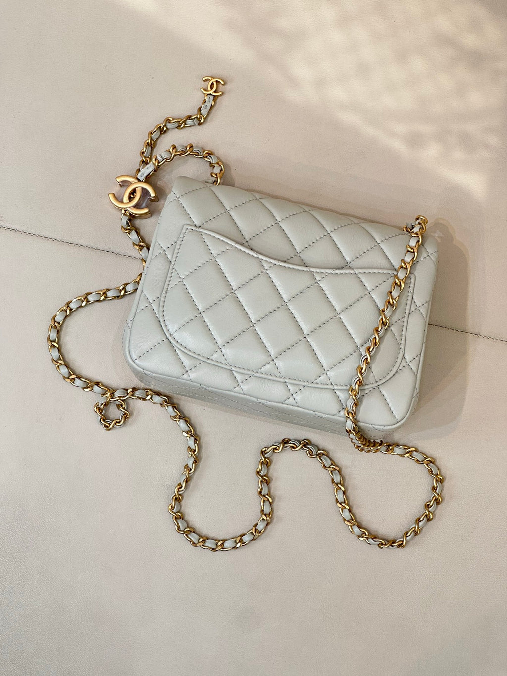 Chanel quilted crossbody bag, light blue with gold chain and front CC emblem