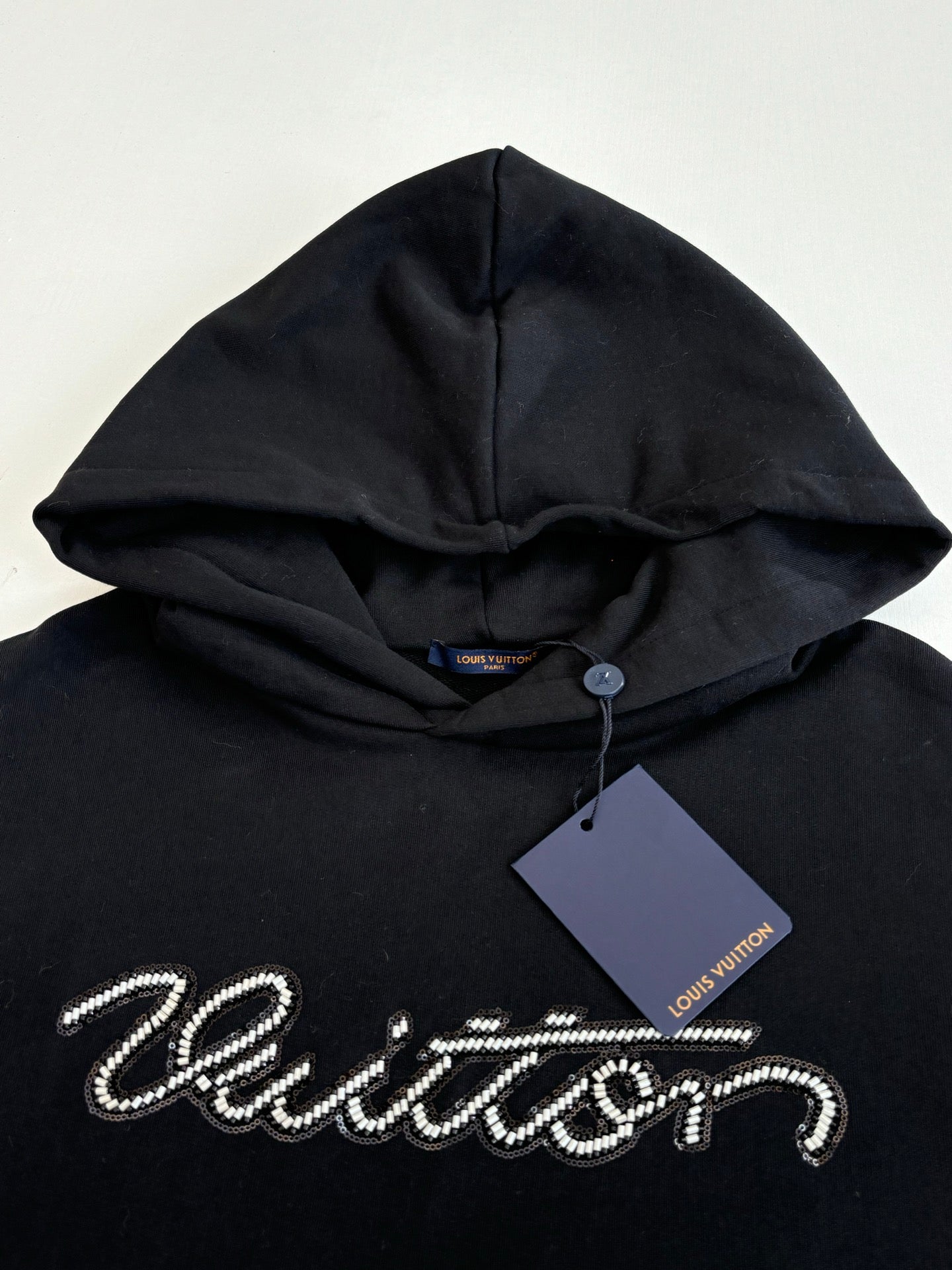 Black Louis Vuitton hooded sweatshirt with drawstring hood and logo detail