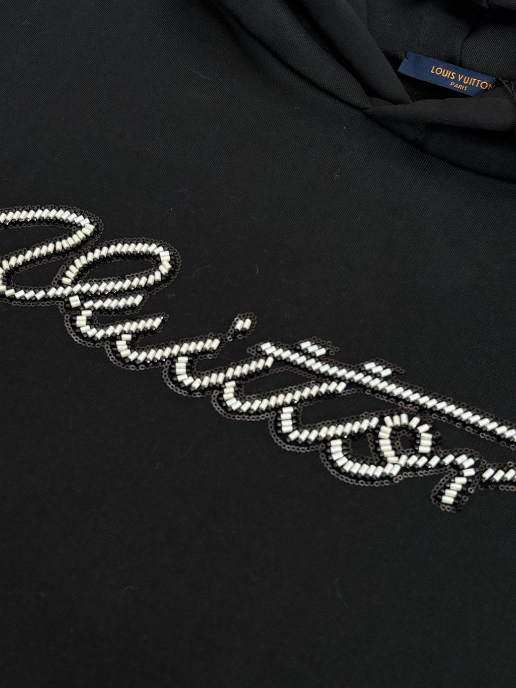 Black Louis Vuitton hooded sweatshirt chest logo in rhinestone-like stitching