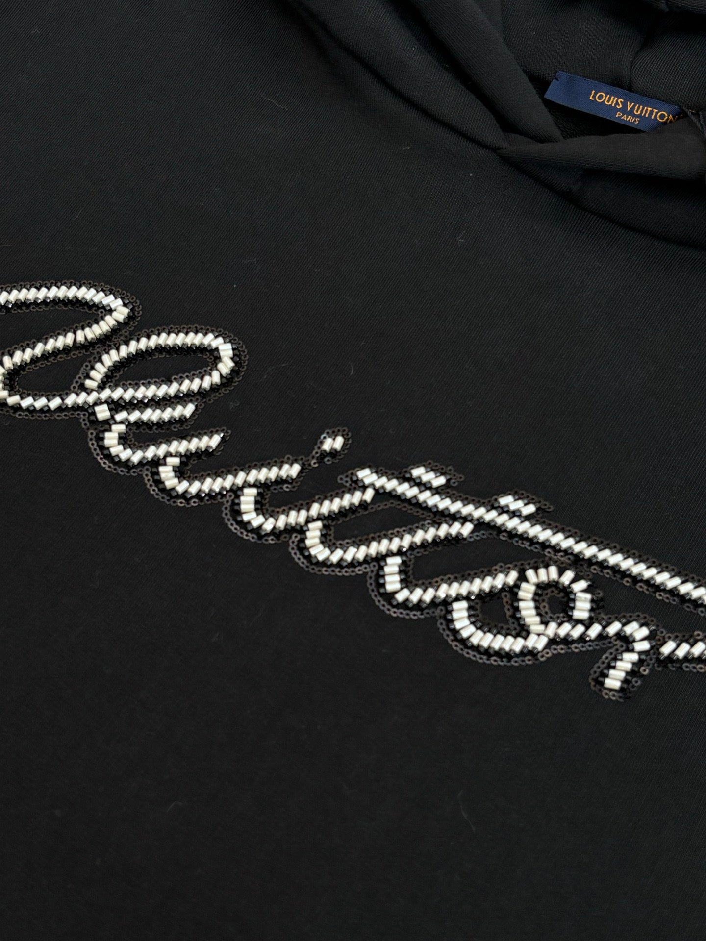 Black Louis Vuitton hooded sweatshirt chest logo in rhinestone-like stitching