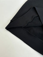 Black Louis Vuitton hooded sweatshirt fabric and seam detail near shoulder