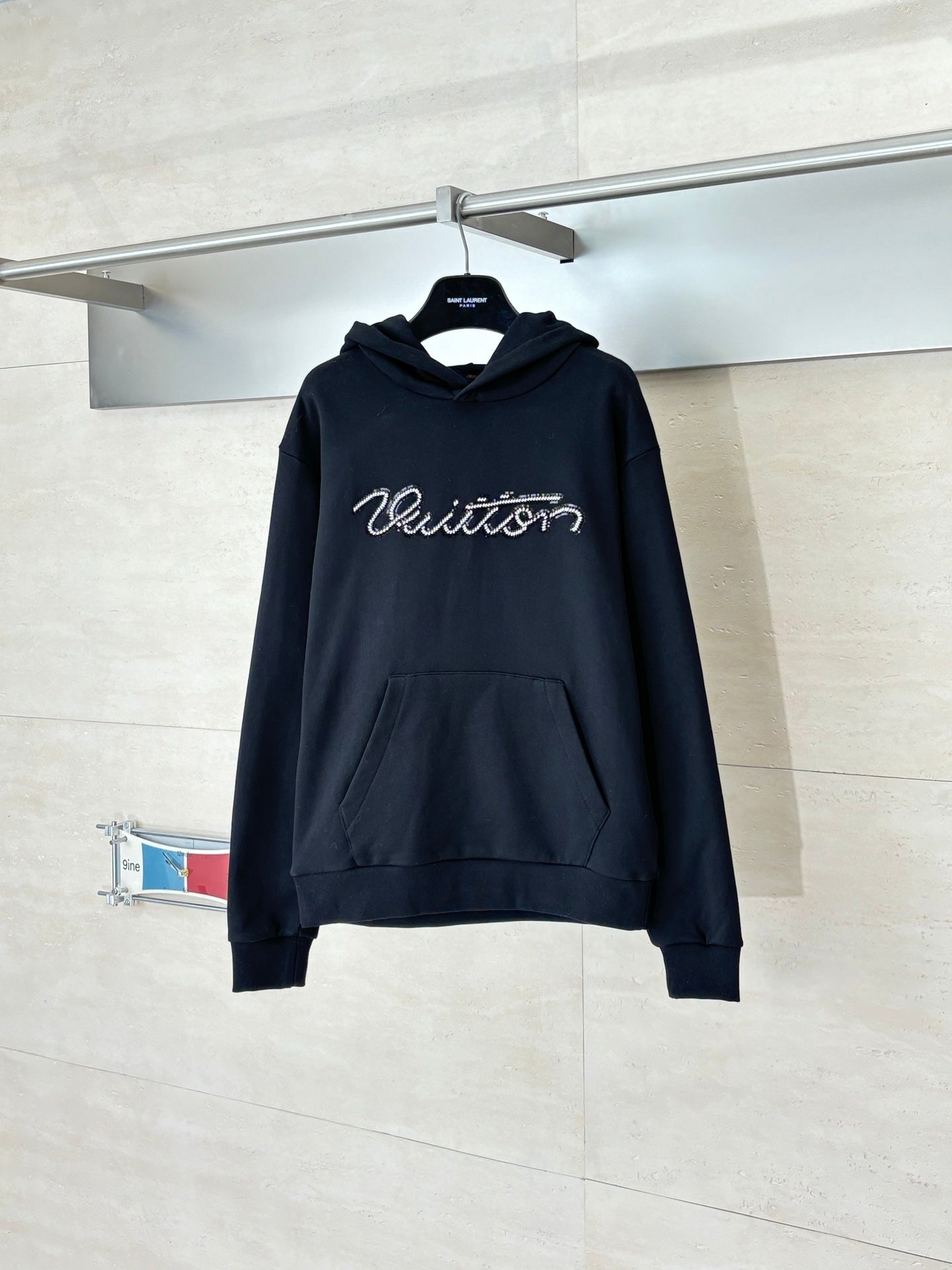 Black Louis Vuitton hooded sweatshirt with front pouch pocket and cursive logo