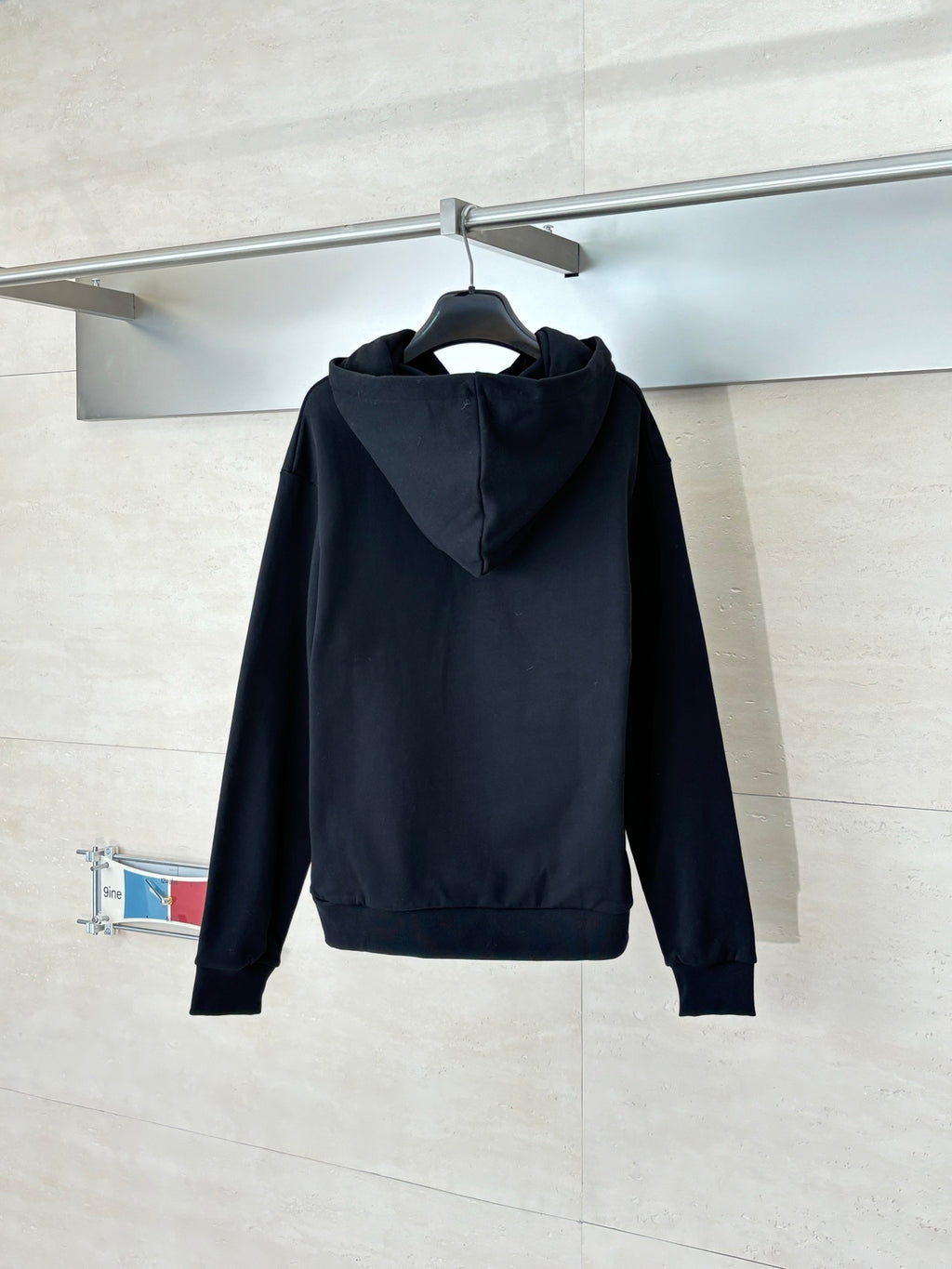Black Louis Vuitton hooded sweatshirt, back view with adjustable hood
