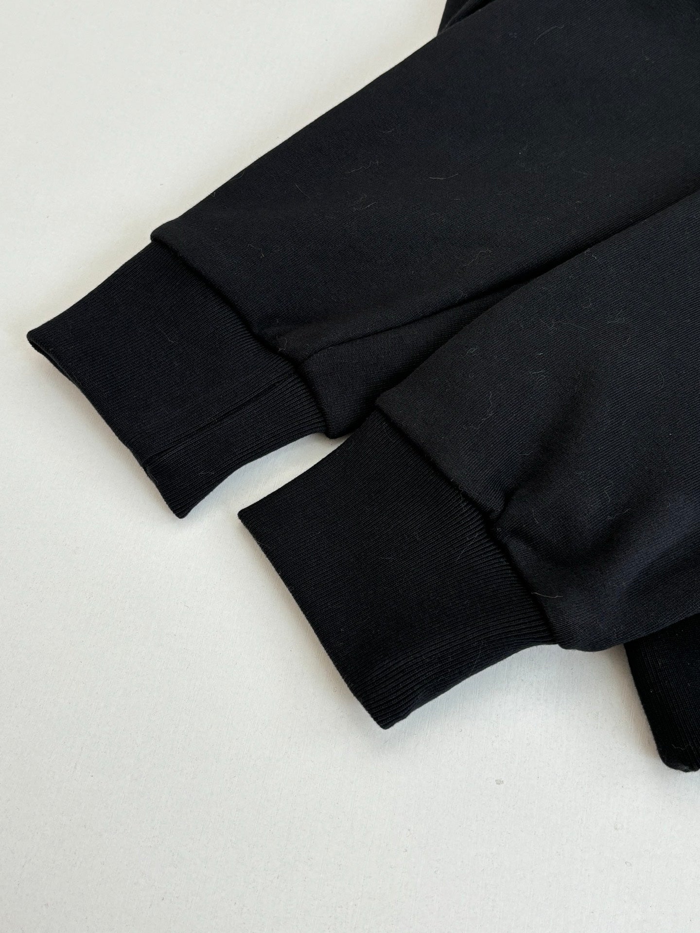 Black Louis Vuitton hooded sweatshirt sleeve cuff and folded hem