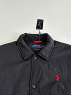 Black button-up jacket with stand collar and red polo pony logo
