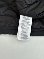 Black jacket interior care label stitched inside collar