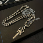 Silver-tone sword-like charm necklace with oval chain and clasp