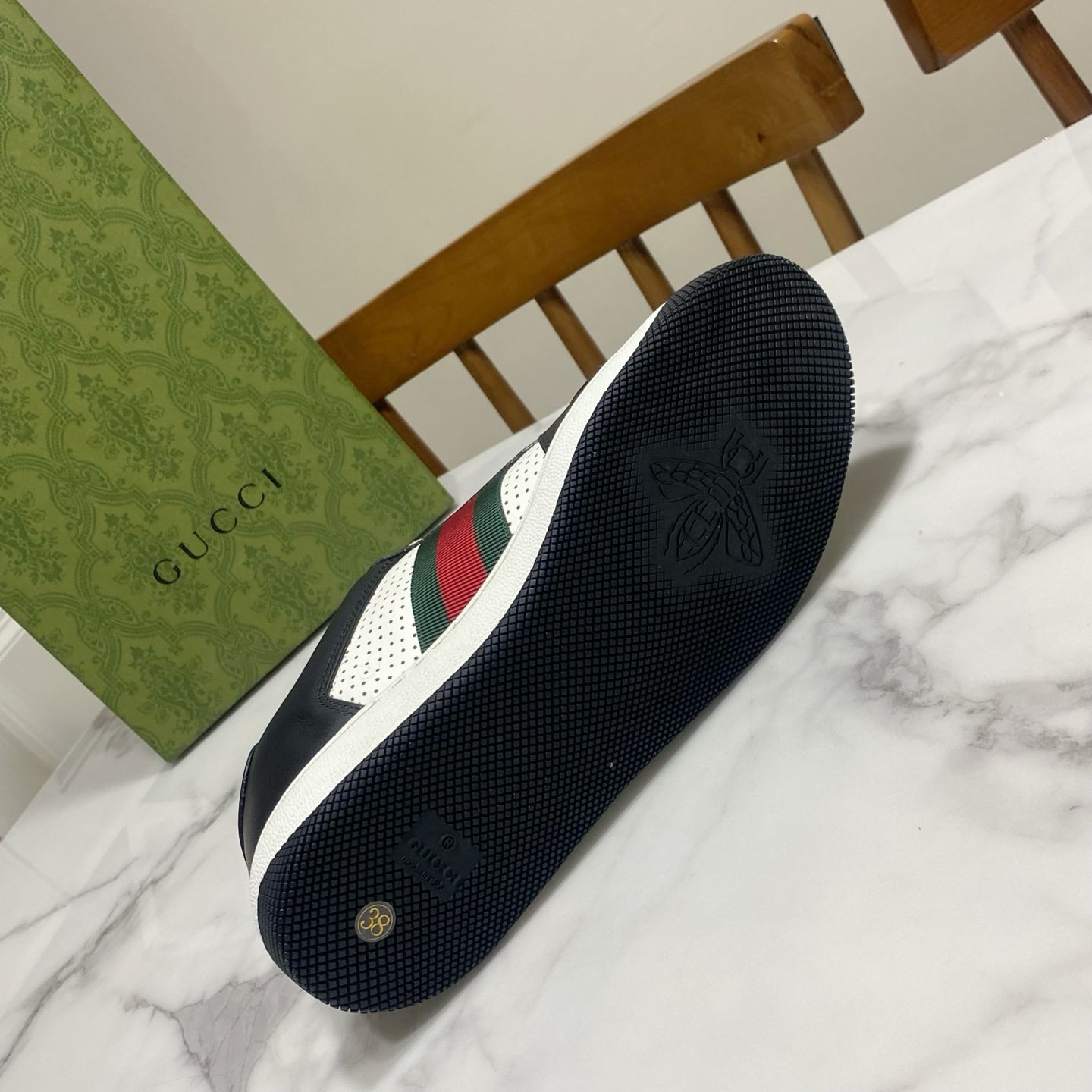 Gucci unisex sneakers outsole view with navy textured rubber and logo embossing