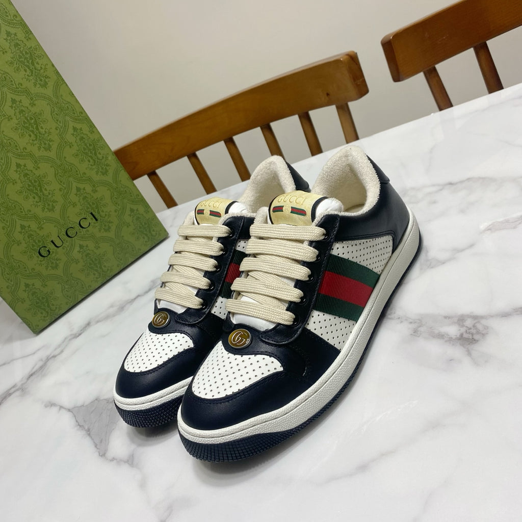 Gucci unisex sneakers in navy leather with white perforated panel and striped web