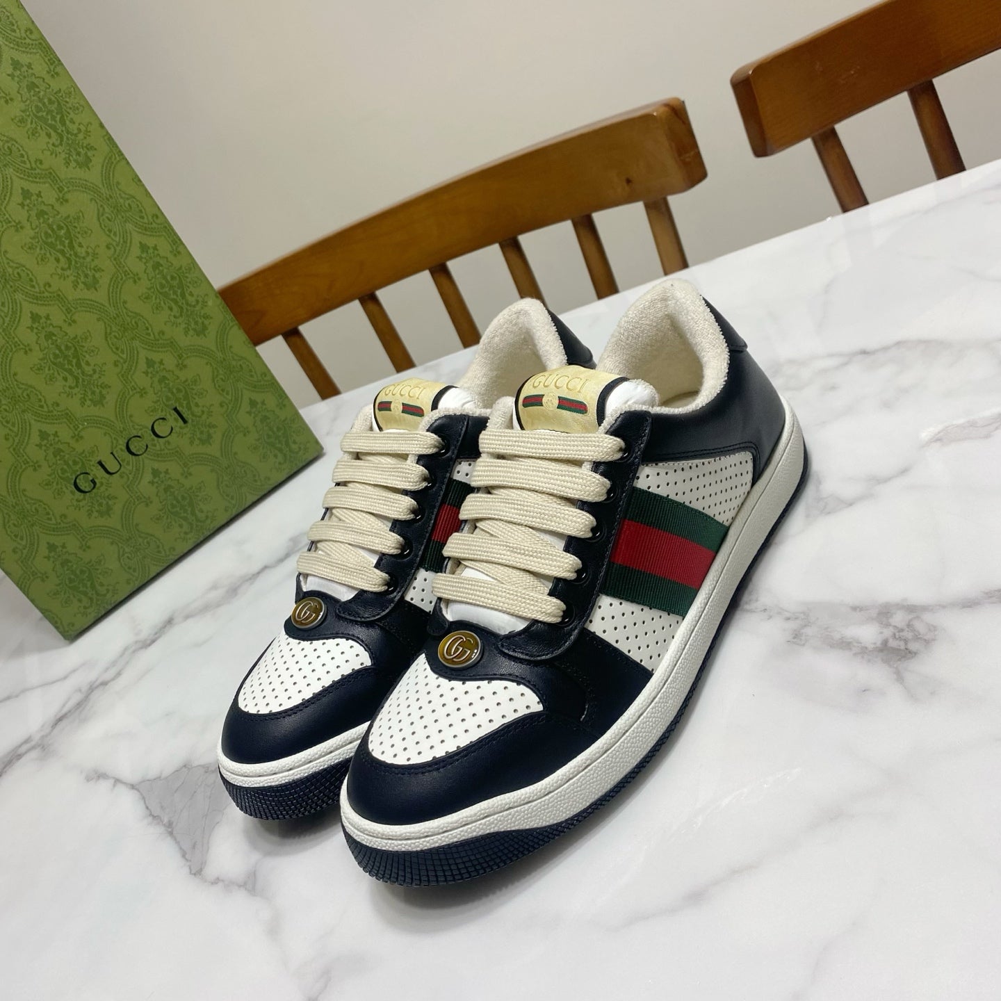 Gucci unisex sneakers in navy leather with white perforated panel and striped web