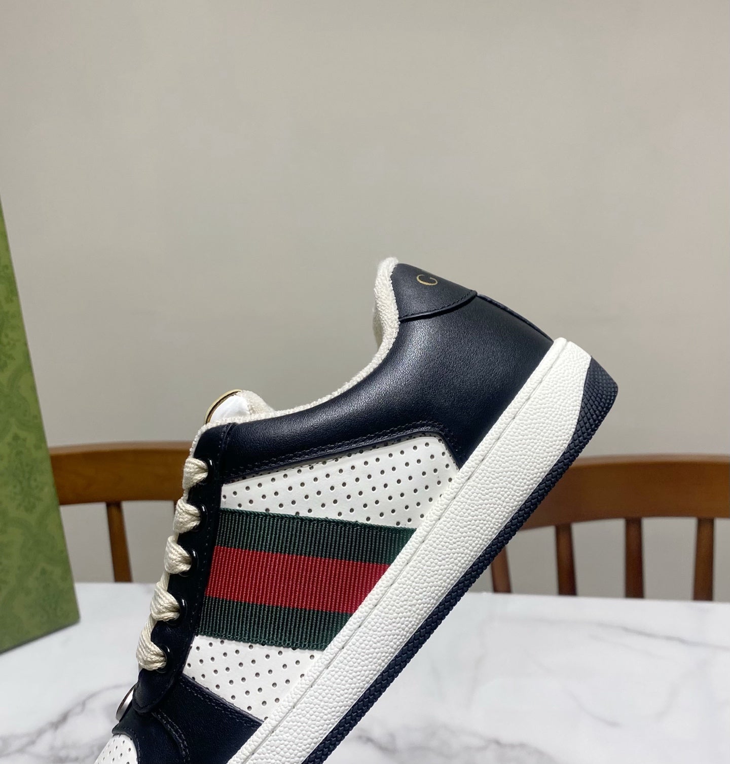 Gucci unisex sneaker side profile, navy leather with white panel and multicolor web stripe