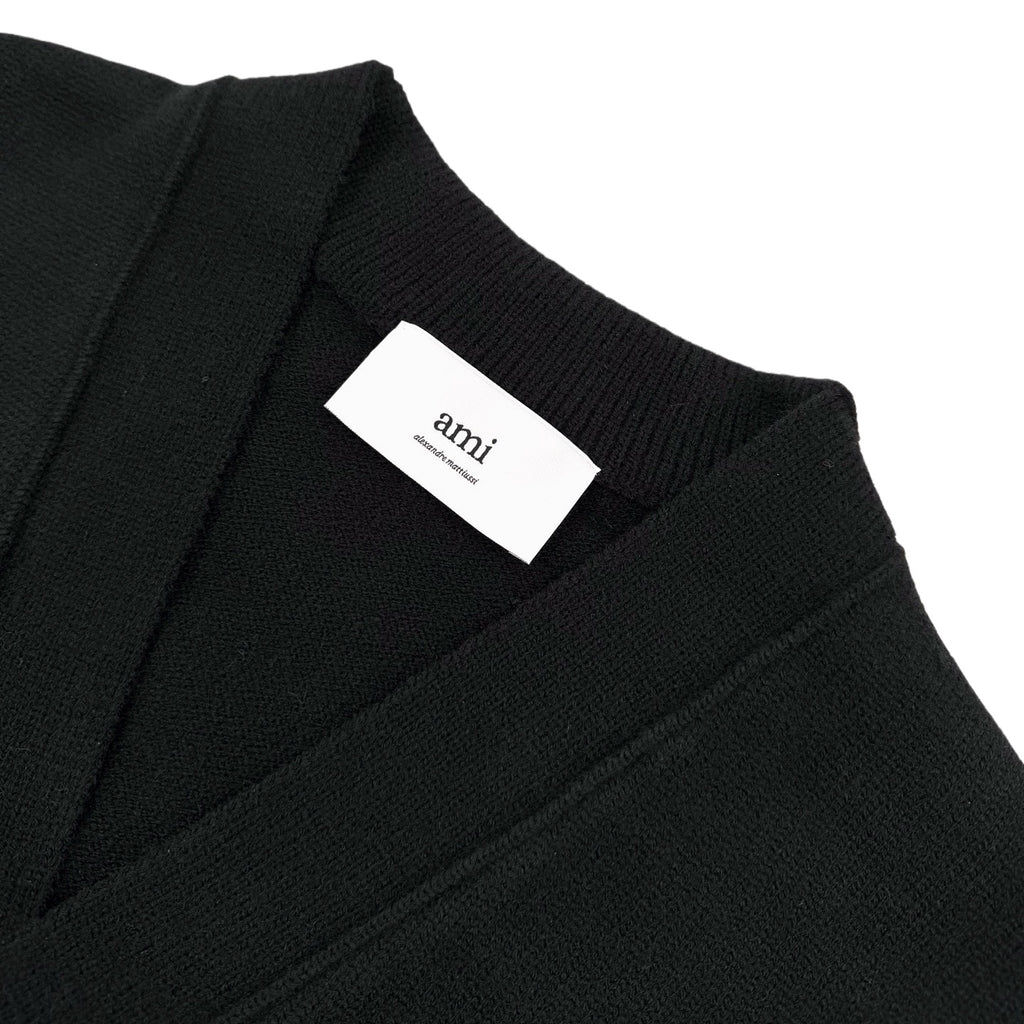 Amiri knit cardigan neckline with white 'amiri' label