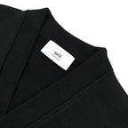 Amiri knit cardigan neckline with white 'amiri' label