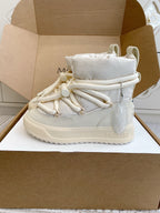 White Moncler high-top sneaker with thick laces, padded collar, shown in box