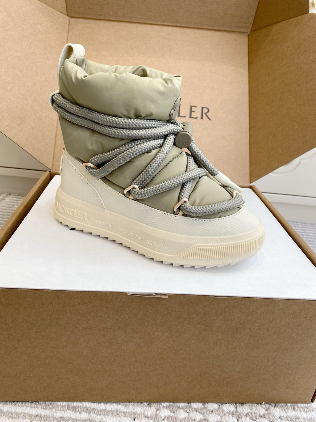 Moncler high-top sneaker in box with sage green upper, gray lace trim, and white sole