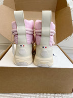 Moncler pink puffer sneakers back view with white heel straps and logo patch