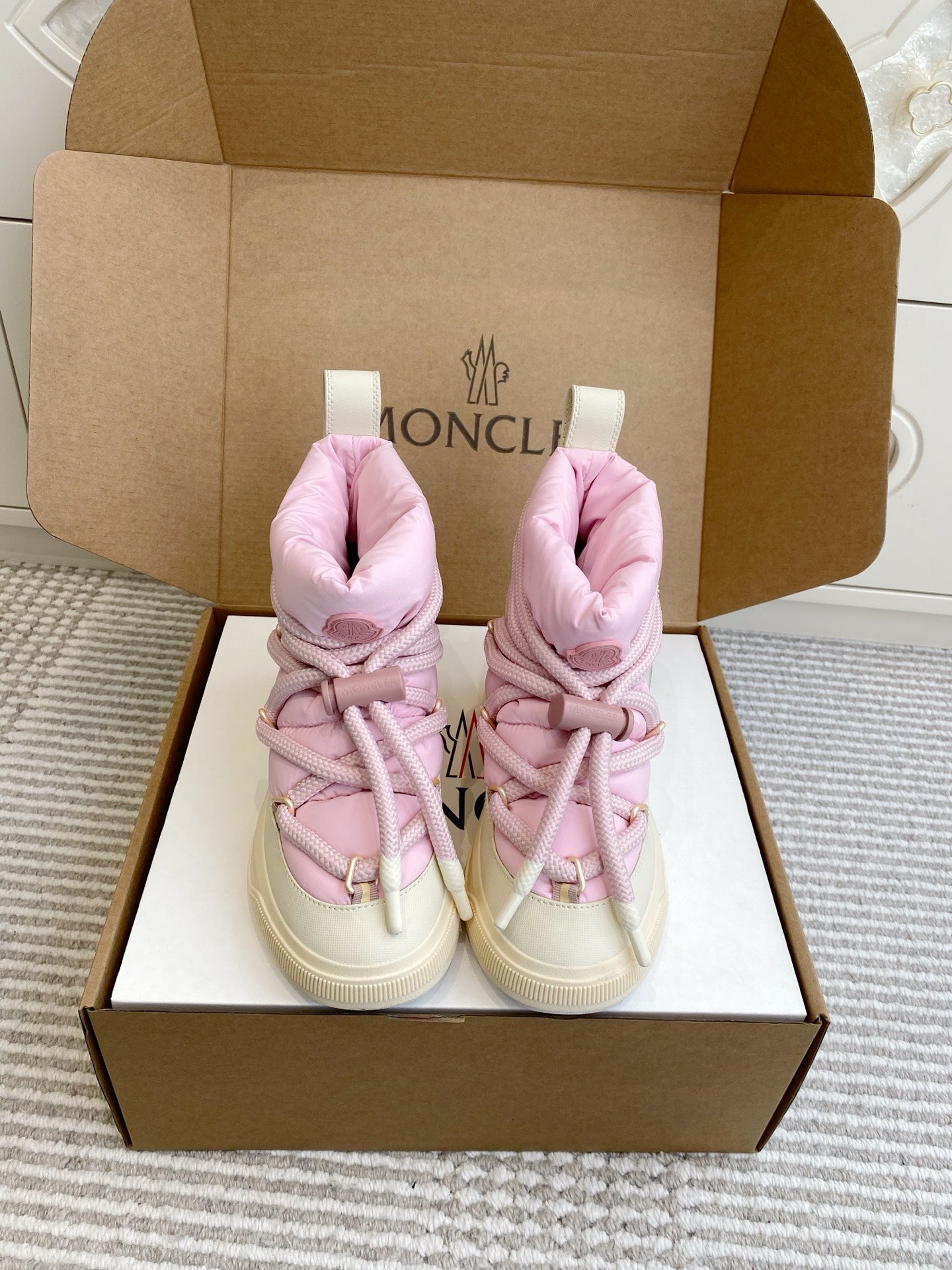 Moncler pink puffer sneakers with laces and padded ankle collar