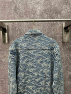 Blue denim jacket back view with all-over monogram pattern and buttoned yoke seam