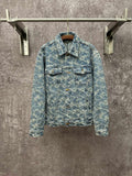 Blue denim jacket with all-over monogram pattern, button front, and flap chest pockets