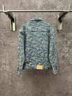 Blue denim jacket with all-over monogram pattern, button back, and waistband detail