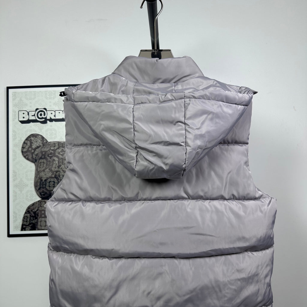 Amiri hooded puffer vest, light gray, back view with hood and center seam