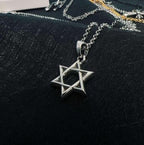 Chrome accessory necklace with star-shaped pendant, silver-tone chain