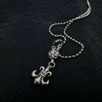 Chrome accessory necklace with anchor charm and small key-like detail