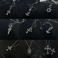 Chrome accessory necklace set with star, bow, cross, dagger, and anchor charms