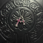 Silver-tone cross pendant necklace with red gem accents and double chain