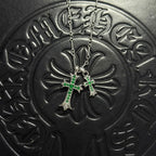 Silver-tone cross pendant necklace with green gem accents and double chain
