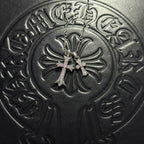 Silver-tone cross pendant necklace with light-colored gem accents and double chain