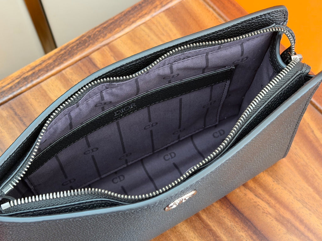 Dior bag interior with debossed CD pattern lining and silver zipper trim