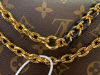 Louis Vuitton monogram canvas with gold-tone chain strap and clasp ring