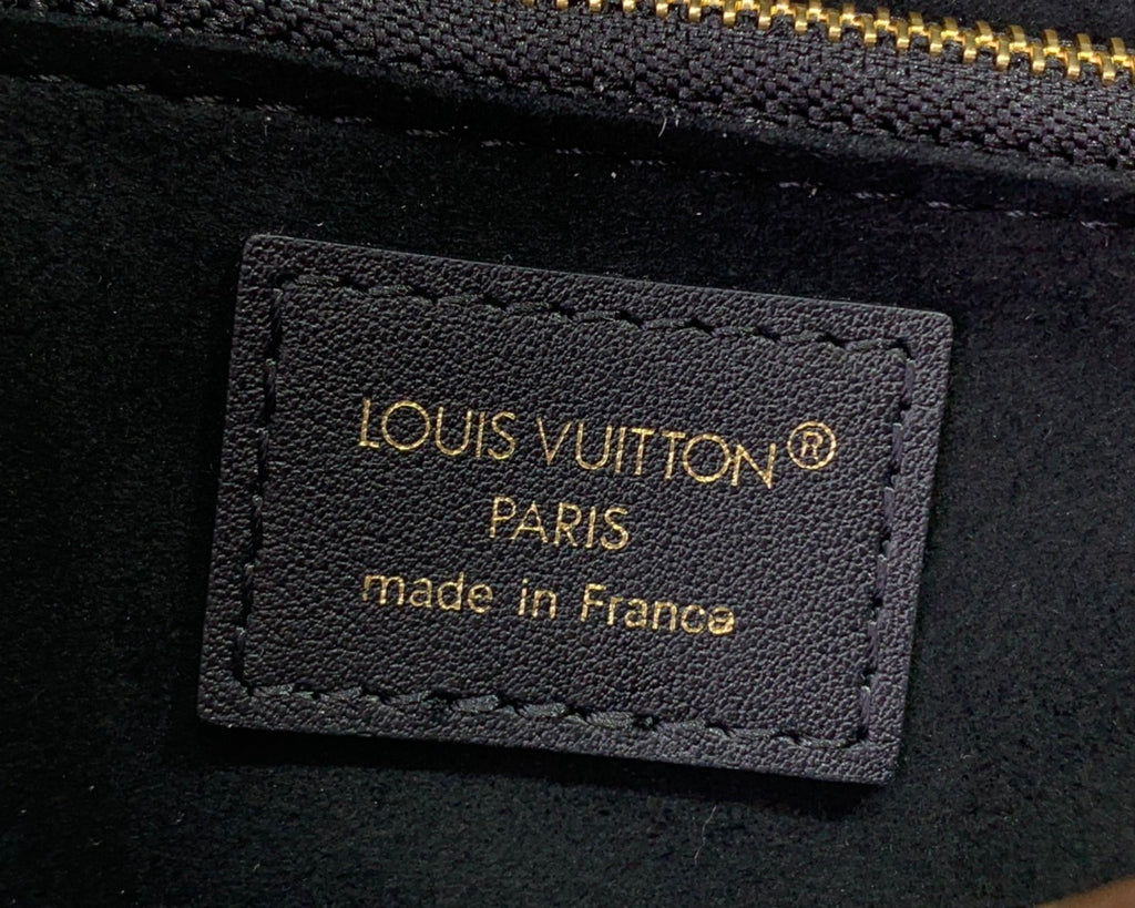 Louis Vuitton Paris leather logo patch on monogram canvas bag