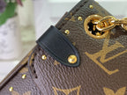 Louis Vuitton monogram canvas bag corner with leather strap tab and gold studs