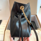 Saint Laurent black mini bag with gold chain handle and drawstring-like cinch top