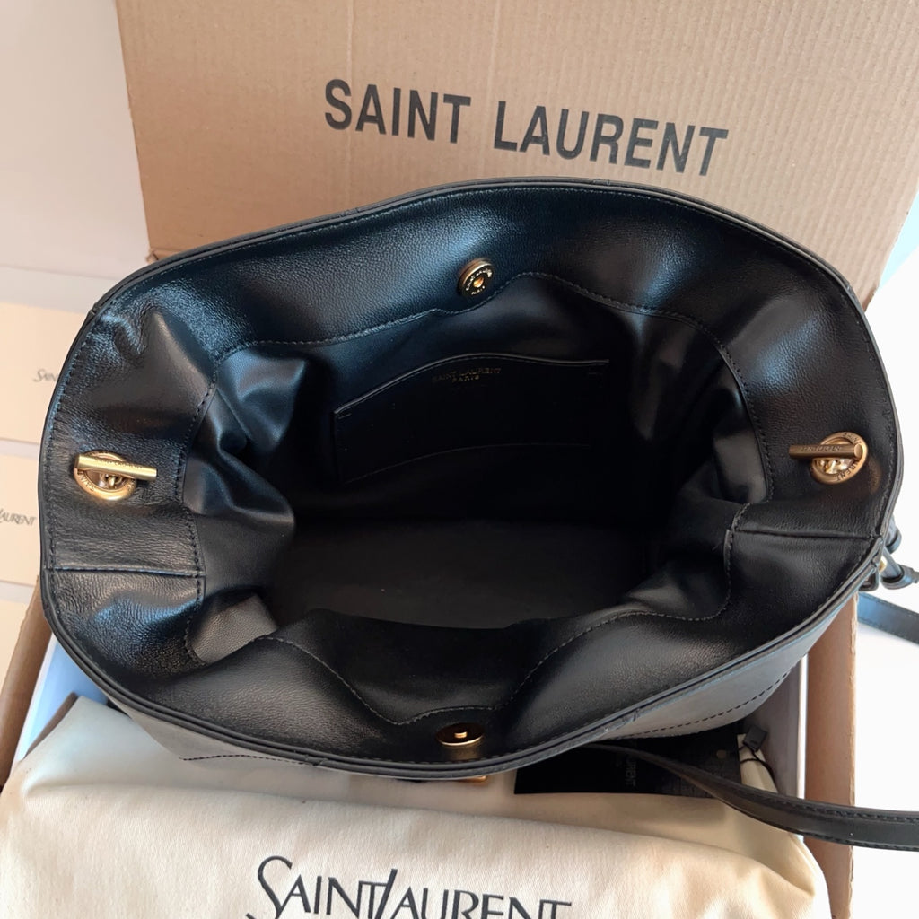 Saint Laurent bag open top with black interior lining and gold hardware details