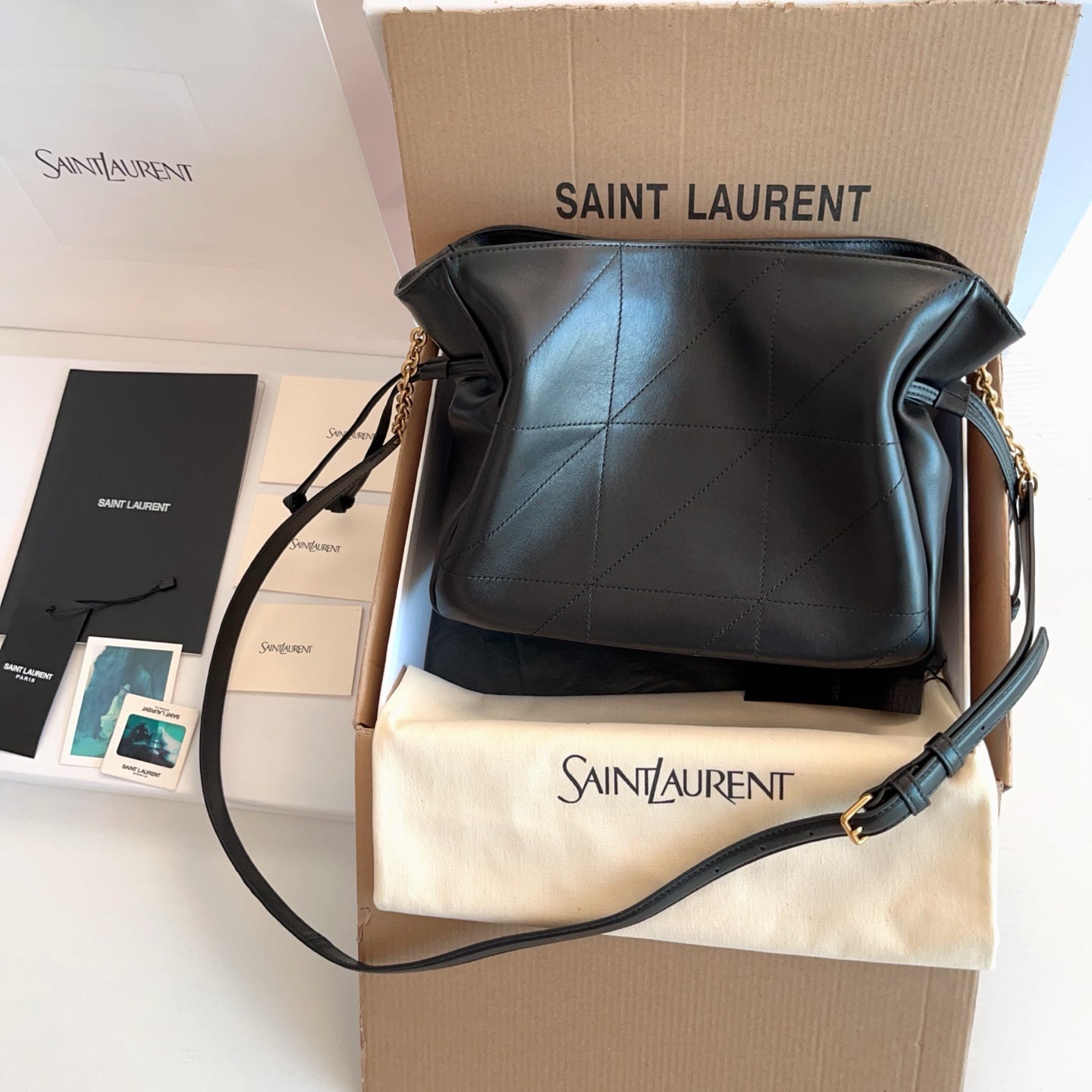 Saint Laurent small hobo bag with black quilted body and cream pouch, gold logo