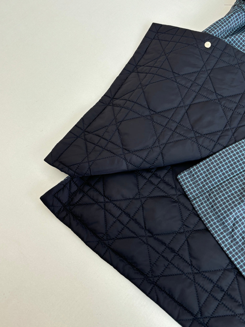 Navy quilted inner lining pieces with buttoned edges